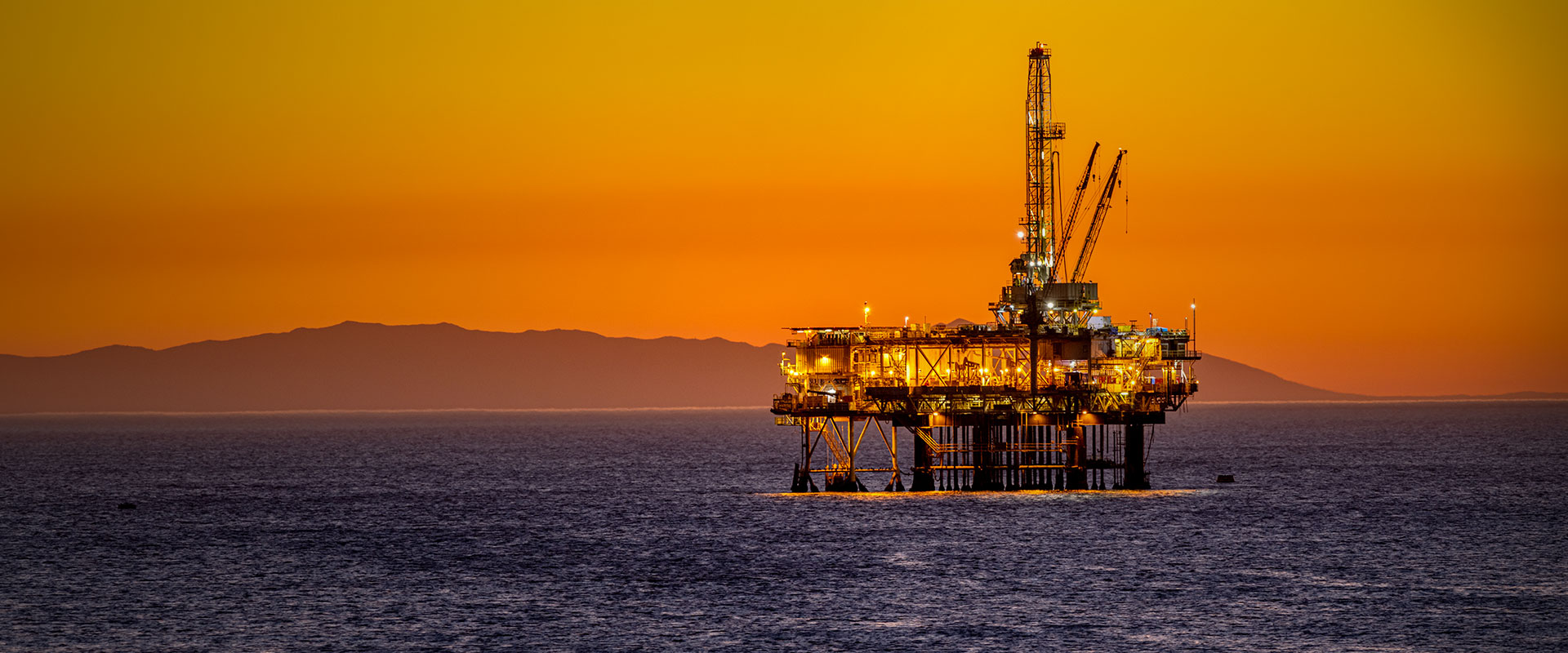 Offshore oil platform at dusk